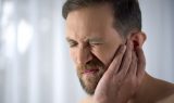 Man Holding His Aching Ear, Suffering From Otitis, Sudden Hearin