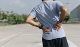 Young Asian Runner Sustains A Back Pain Injury, Sport Injury, Ma
