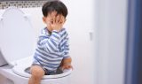 child sitting on the toilet child uti symtoms