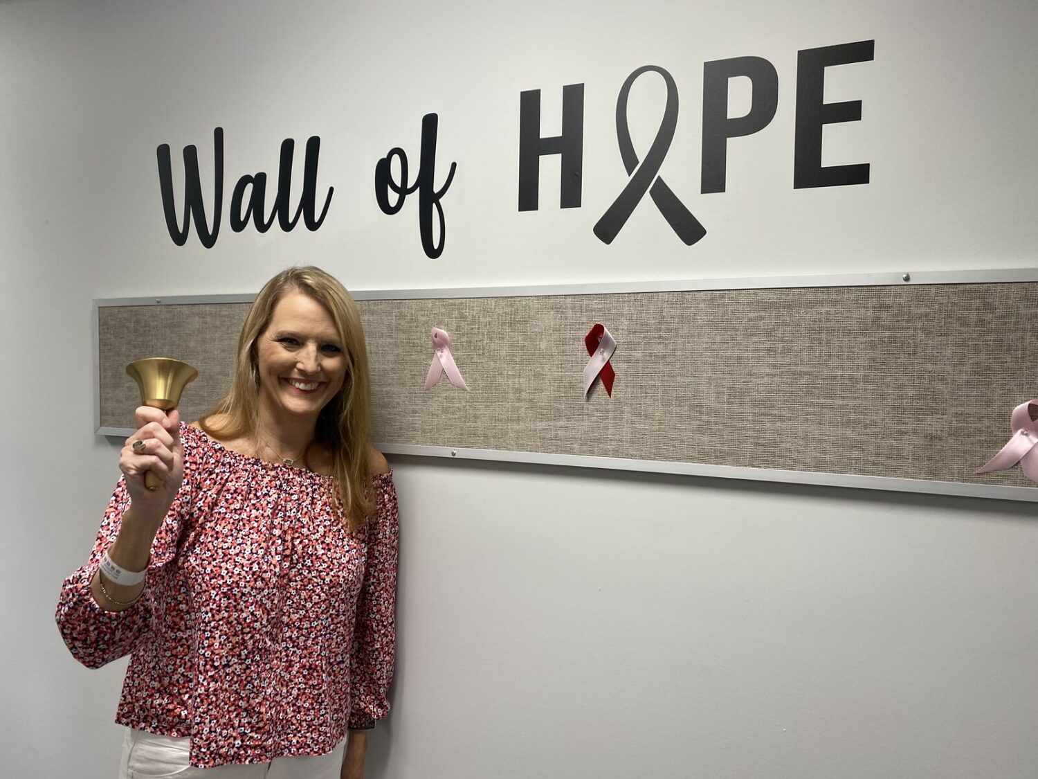 Allyson Floyd rings bell at Wall of Hope after surviving breast cancer (Credit: Allyson Floyd)