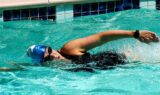 A woman swims as one of the easy exercises for beginners