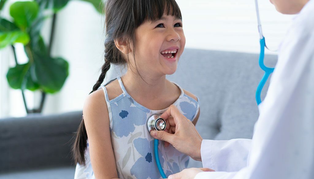 Young Child With Doctor Wondering What Is Family Medicine?