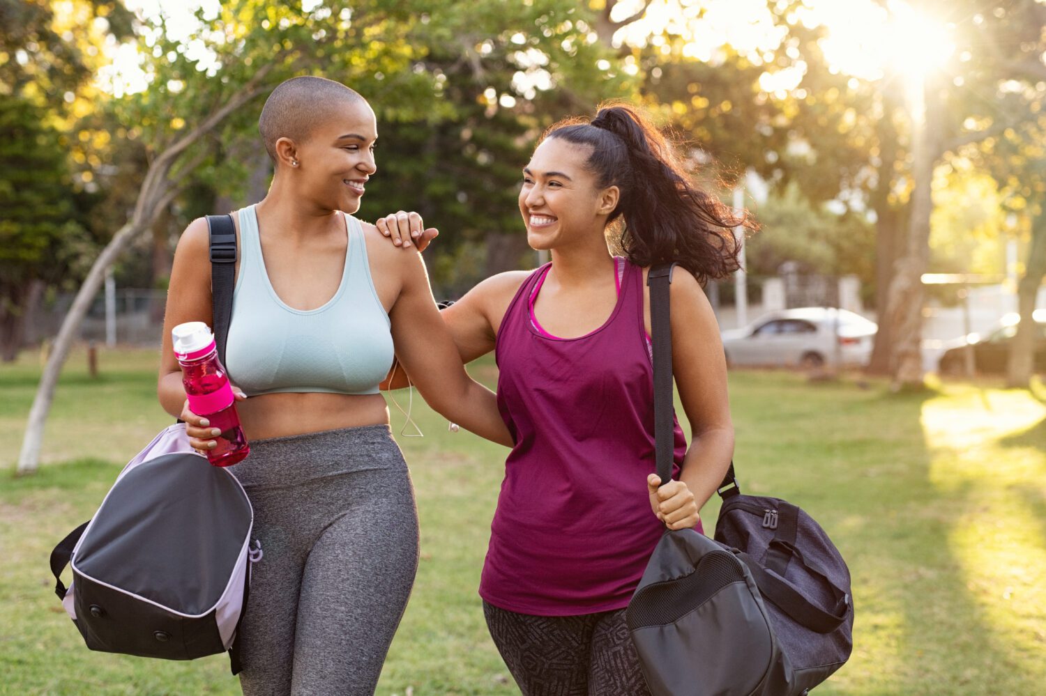 Curvy friends walking home after fitness exercise